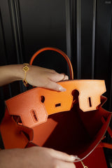 Hermes brikin orange handbag